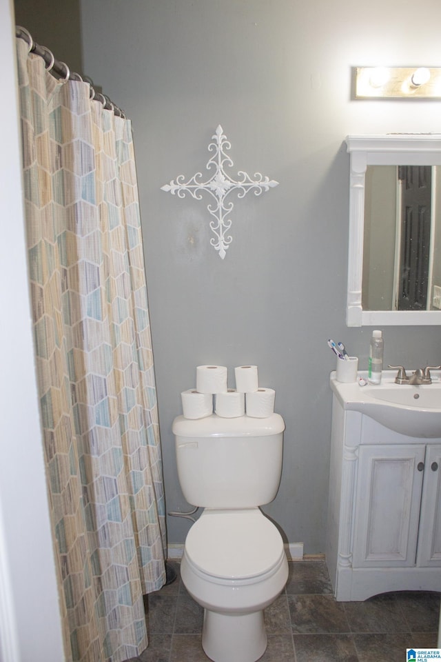 1536 Buckelew Bridge Rd, Anniston, AL 36207 - full bath featuring tile patterned flooring, baseboards, vanity, and toilet