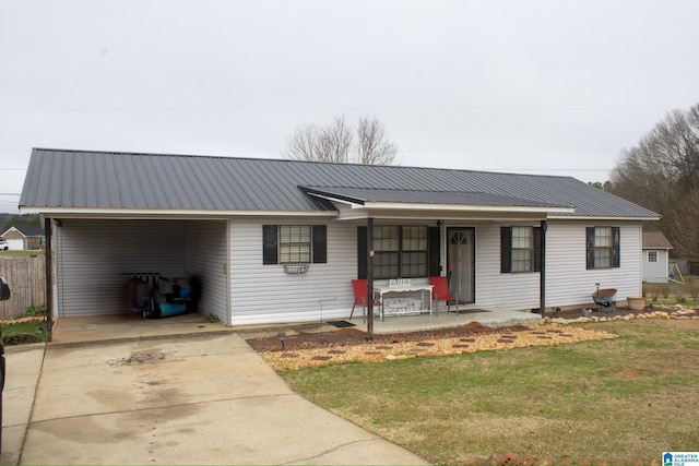 1536 Buckelew Bridge Rd, Anniston, AL 36207 - ranch-style house featuring metal roof, a front lawn, a porch, and concrete driveway