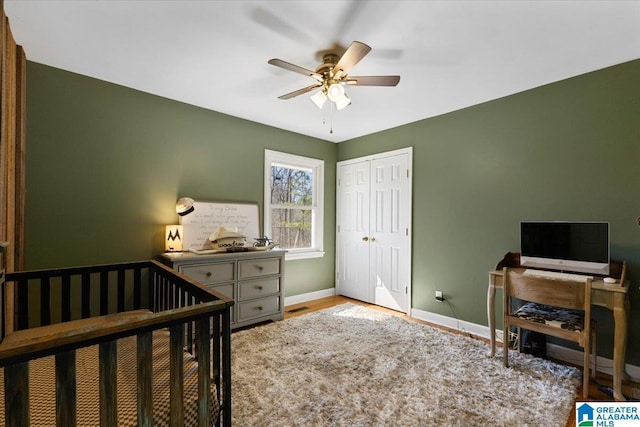 bedroom featuring a closet, visible vents, ceiling fan, wood finished floors, and baseboards