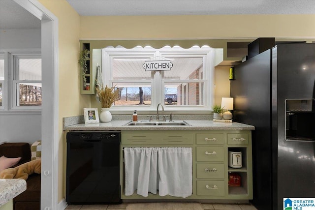 kitchen featuring light countertops, a sink, green cabinetry, dishwasher, and stainless steel fridge with ice dispenser