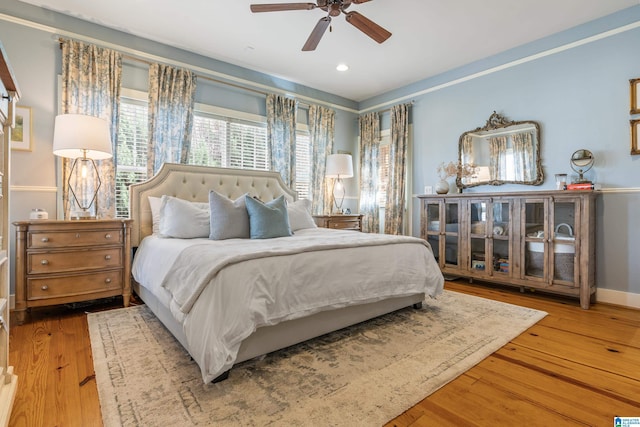 bedroom with ceiling fan and wood-type flooring