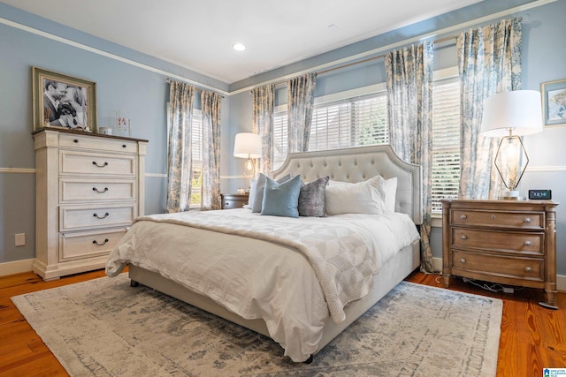 bedroom with dark wood-type flooring