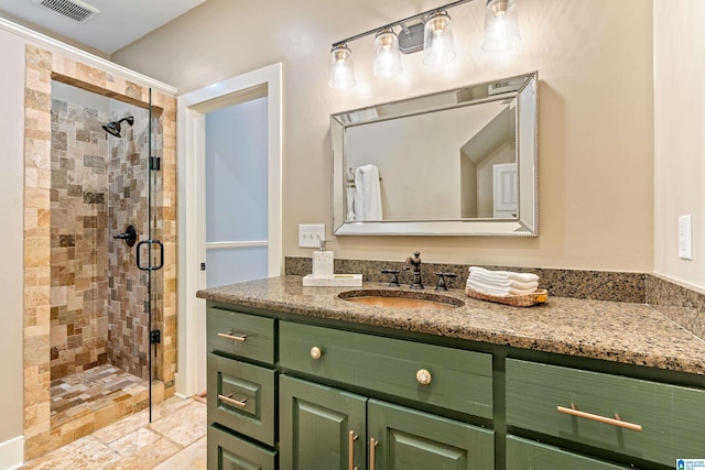 bathroom with vanity and a shower with shower door