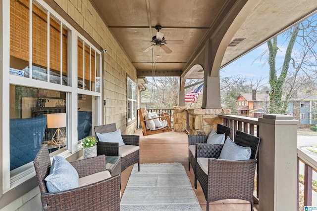 exterior space featuring an outdoor living space and ceiling fan