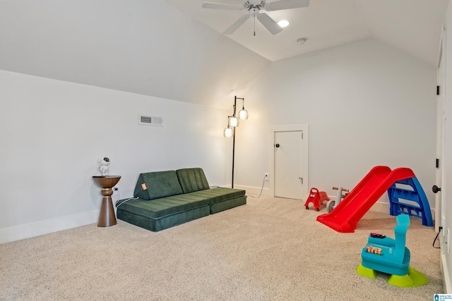 playroom featuring carpet, lofted ceiling, and ceiling fan