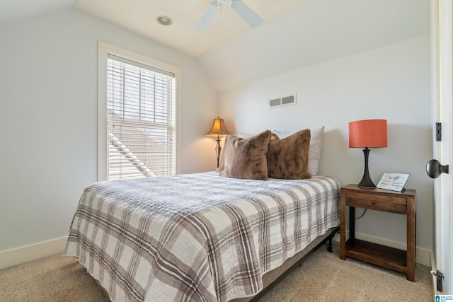 bedroom featuring ceiling fan, light carpet, and lofted ceiling