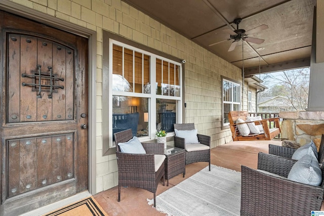 wooden deck featuring ceiling fan and a porch