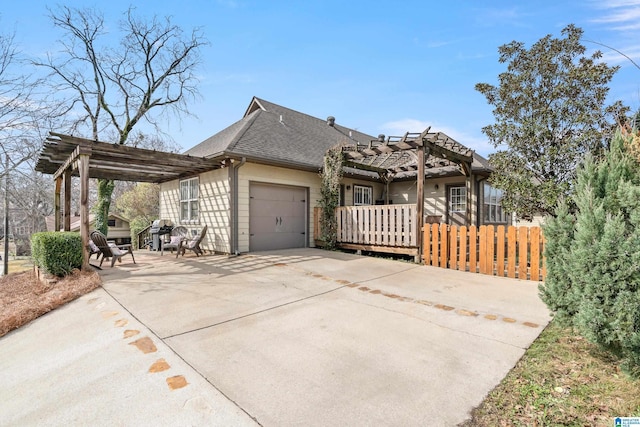 view of front of property with a patio, a garage, and a pergola