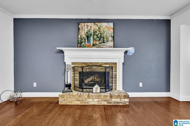 interior details with a fireplace, crown molding, and wood-type flooring