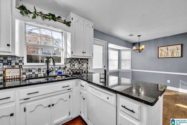 kitchen featuring hanging light fixtures, dishwasher, sink, white cabinetry, and kitchen peninsula