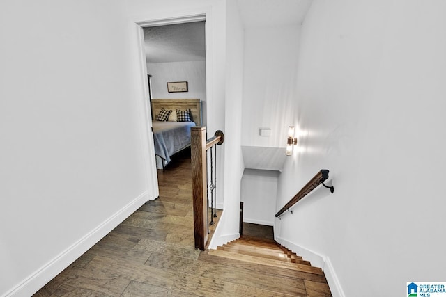 stairway featuring hardwood / wood-style floors