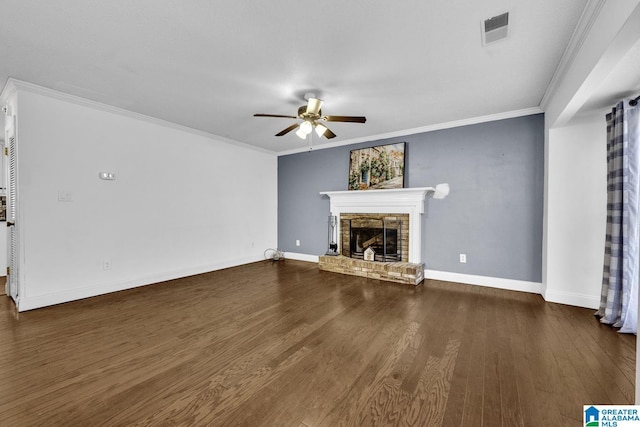 unfurnished living room with a fireplace, ornamental molding, dark hardwood / wood-style flooring, and ceiling fan