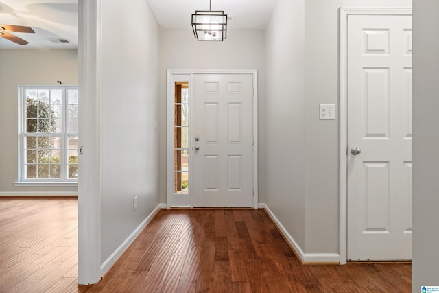 entrance foyer with dark wood-type flooring and ceiling fan