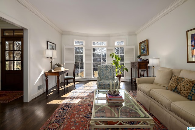 living area featuring dark wood-style flooring, visible vents, crown molding, and baseboards