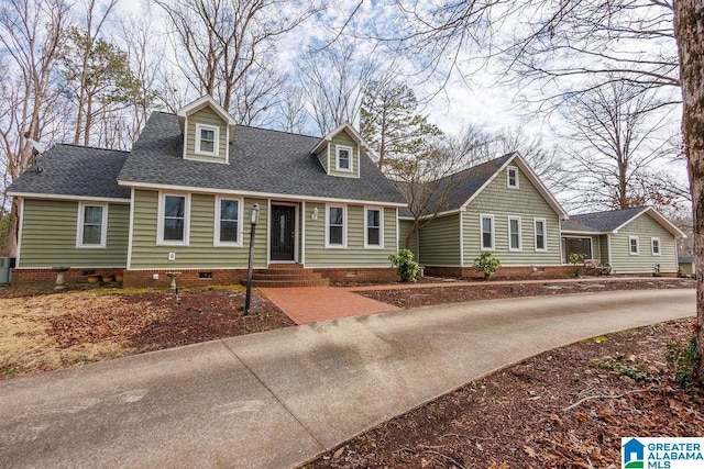 cape cod-style house featuring cooling unit