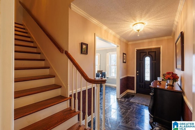 foyer featuring crown molding and a textured ceiling