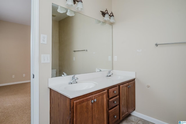 bathroom with toilet and vanity