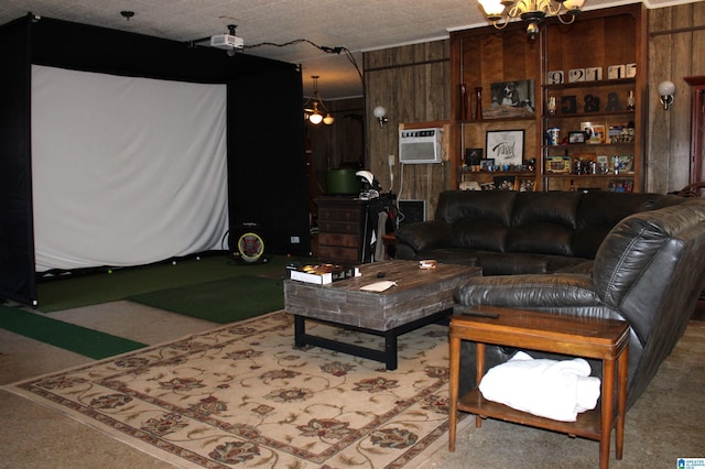 living room featuring a wall unit AC, an inviting chandelier, wooden walls, and golf simulator