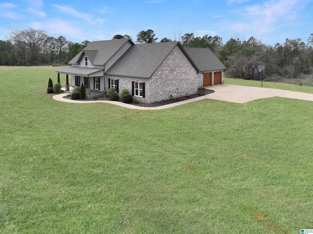 view of front of property featuring a garage and a front yard