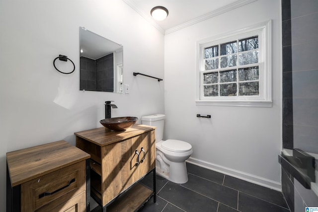 bathroom featuring vanity, tile patterned floors, ornamental molding, and toilet