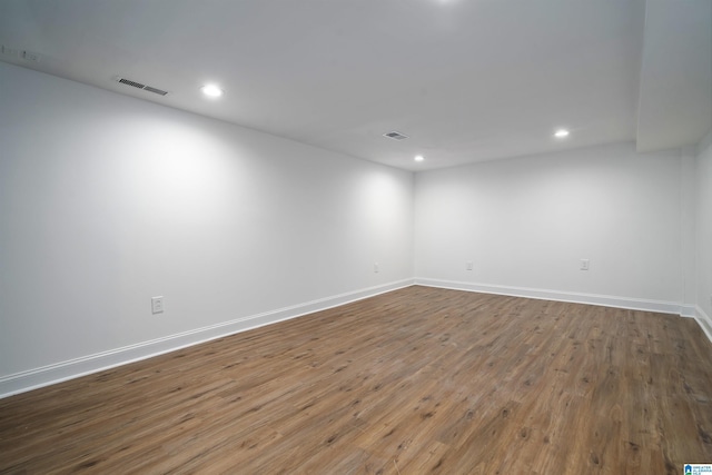 spare room featuring hardwood / wood-style flooring