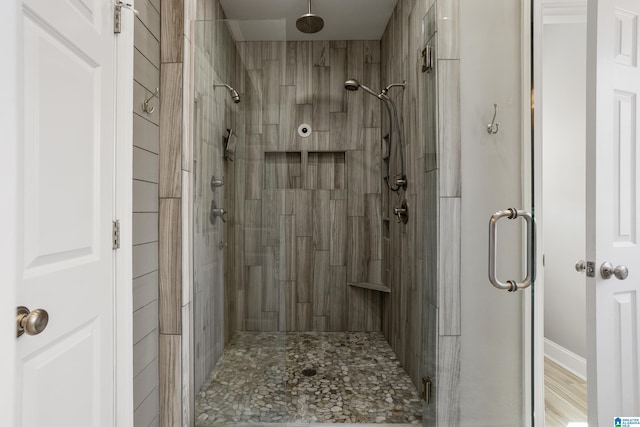 full bath featuring a shower stall