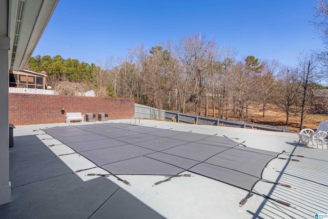 view of swimming pool featuring a patio area, a fenced backyard, and a fenced in pool