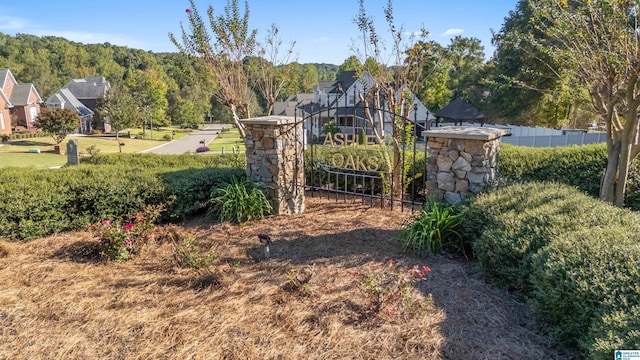 view of gate featuring fence