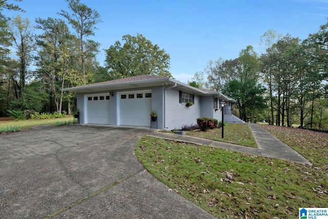 view of side of home with a garage