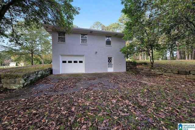 view of side of property featuring a garage