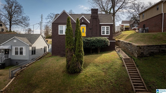 exterior space with a yard and central air condition unit