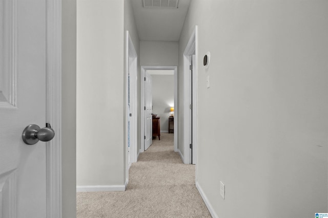 corridor with light carpet