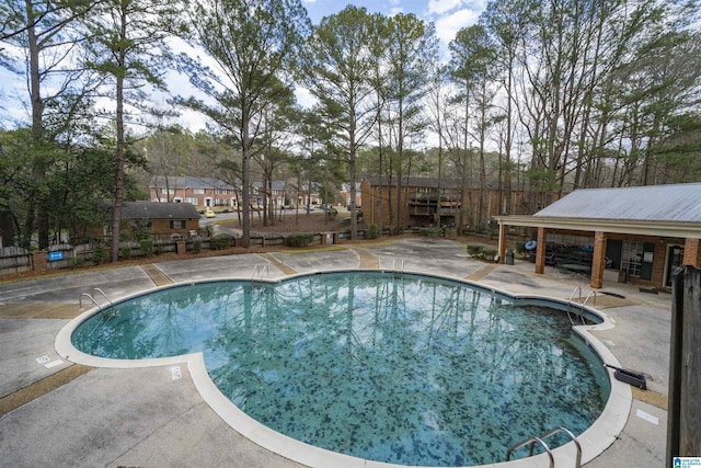 view of swimming pool with a patio