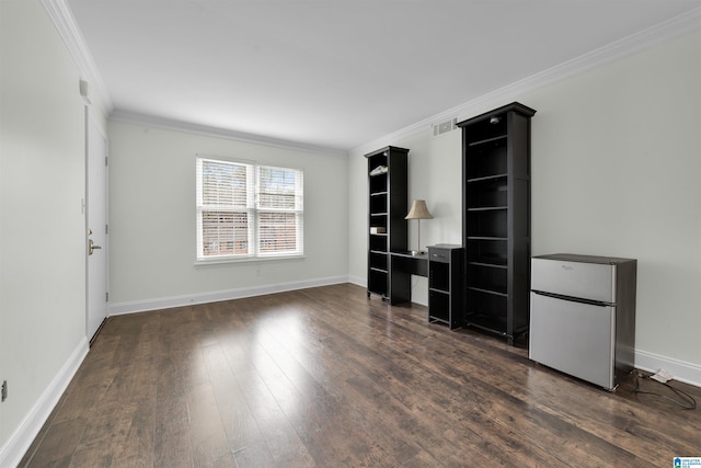 unfurnished living room featuring ornamental molding and dark wood-type flooring