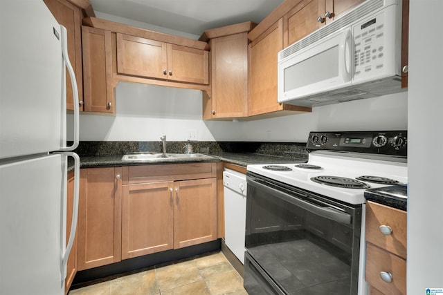 kitchen featuring sink and white appliances