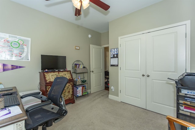 office featuring ceiling fan and light carpet