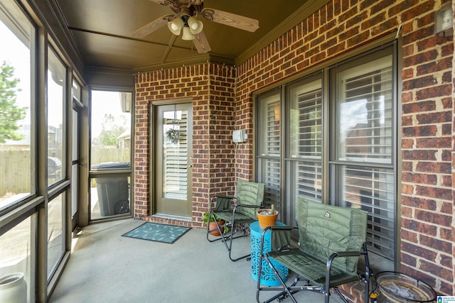 sunroom / solarium with ceiling fan