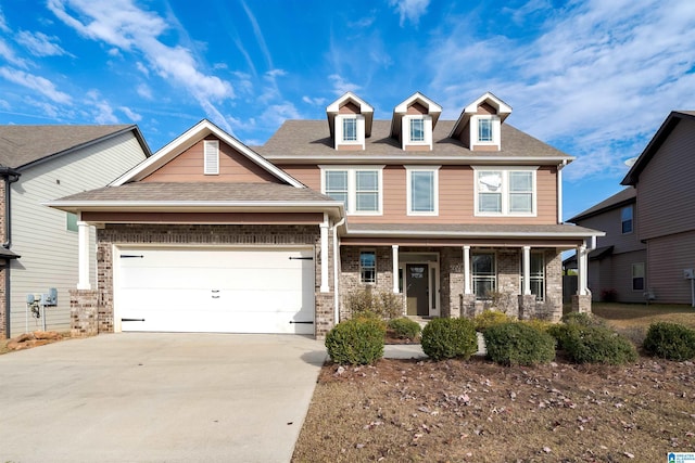 view of front facade with driveway, a shingled roof, a garage, and brick siding