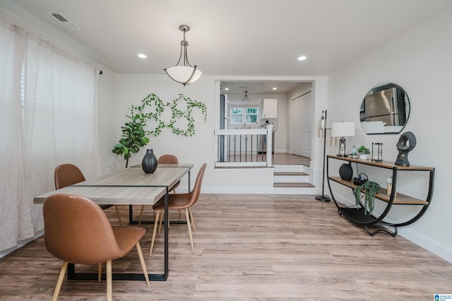 dining area featuring light wood-type flooring