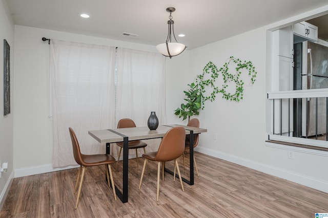 dining area featuring light wood-type flooring