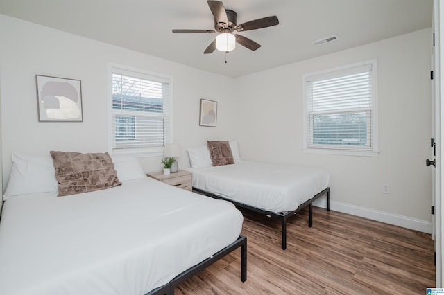 bedroom featuring ceiling fan and hardwood / wood-style floors