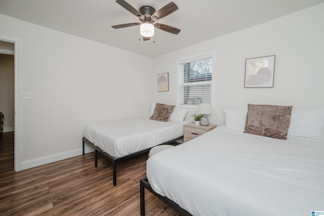 bedroom featuring dark wood-type flooring and ceiling fan