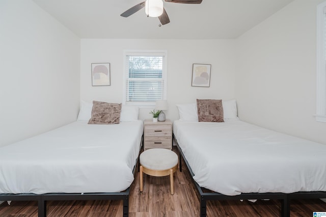 bedroom with hardwood / wood-style floors and ceiling fan