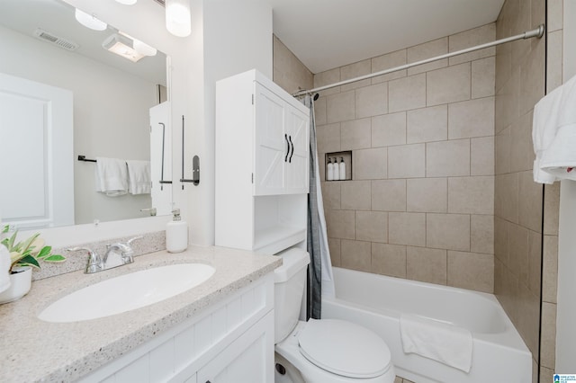 full bathroom featuring vanity, shower / bath combination with curtain, and toilet