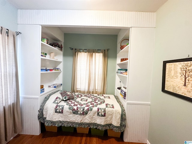 bedroom featuring wood finished floors