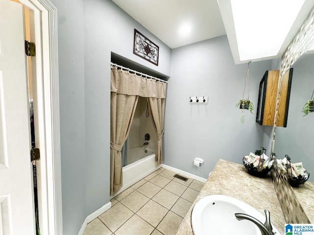 full bathroom with shower / bathtub combination, visible vents, vanity, baseboards, and tile patterned floors