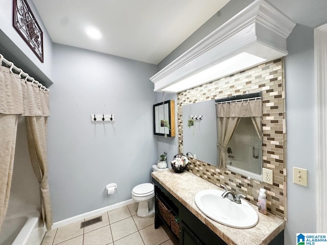 bathroom with tile patterned flooring, toilet, visible vents, baseboards, and tasteful backsplash