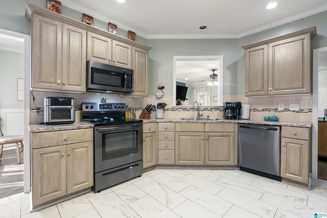 kitchen featuring appliances with stainless steel finishes, marble finish floor, light countertops, and a sink