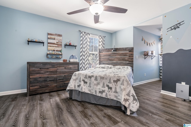 bedroom featuring ceiling fan, baseboards, and dark wood finished floors