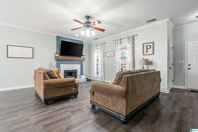 living room with a large fireplace, ceiling fan, visible vents, and baseboards